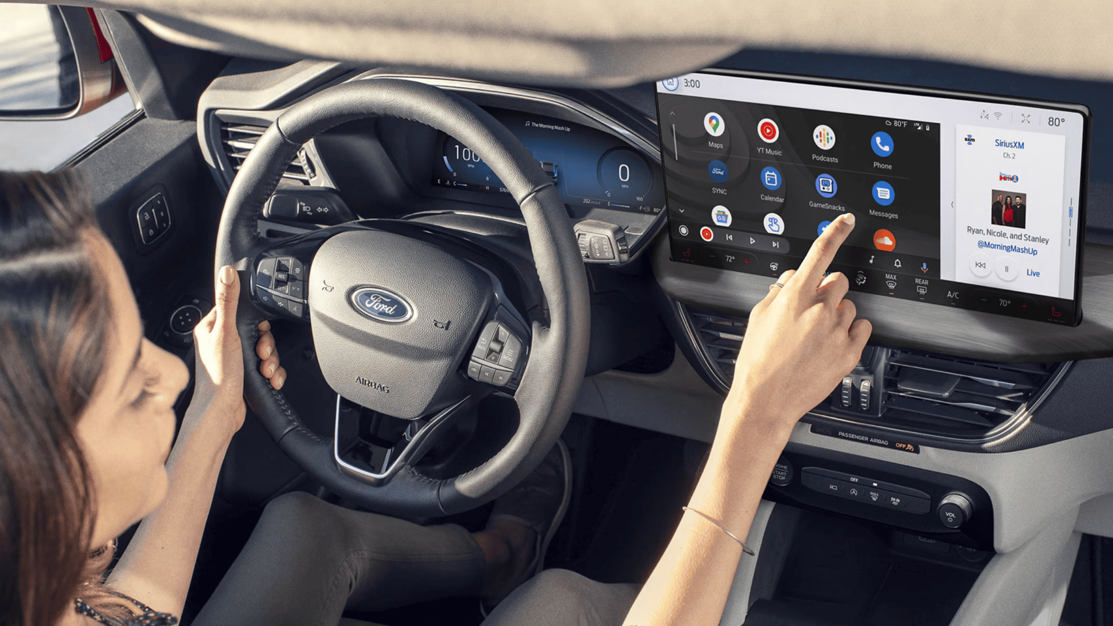 A driver using the high-tech infotainment system in the 2025 Ford Escape®, showcasing a sleek digital interface with navigation, entertainment, and climate control options.
