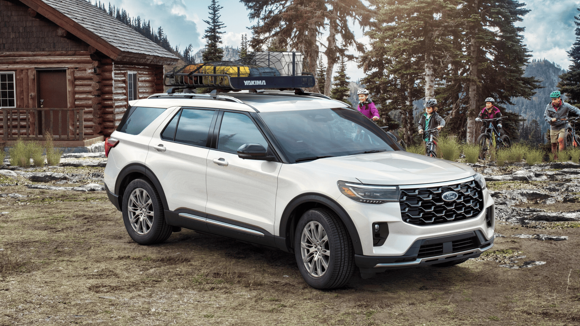 White 2025 Ford Explorer parked in a scenic outdoor setting near Mentor, OH, equipped with a roof rack for adventure gear.