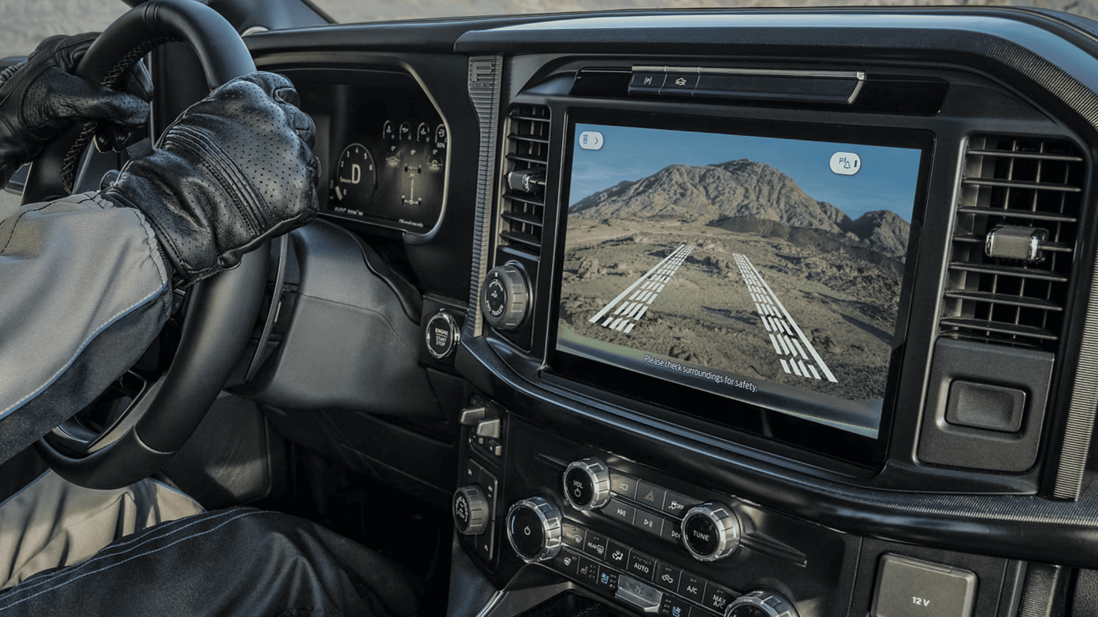 Interior of the 2025 Ford F-150 highlighting its large infotainment display with trail assist camera for off-road navigation.