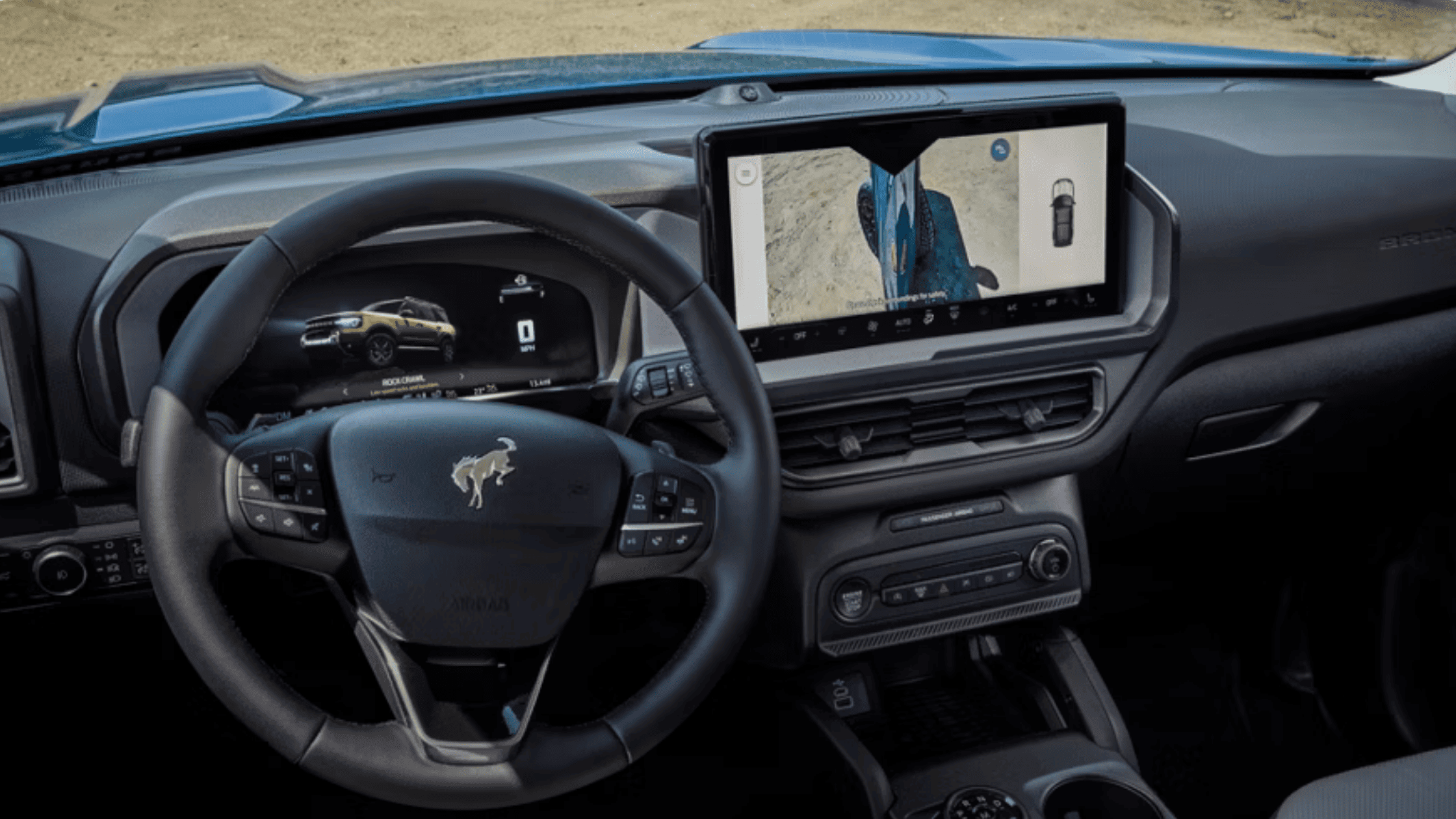 Interior of a 2025 Bronco Sport® showcasing its large touchscreen with off-road camera view and digital driver display near Concord, OH.