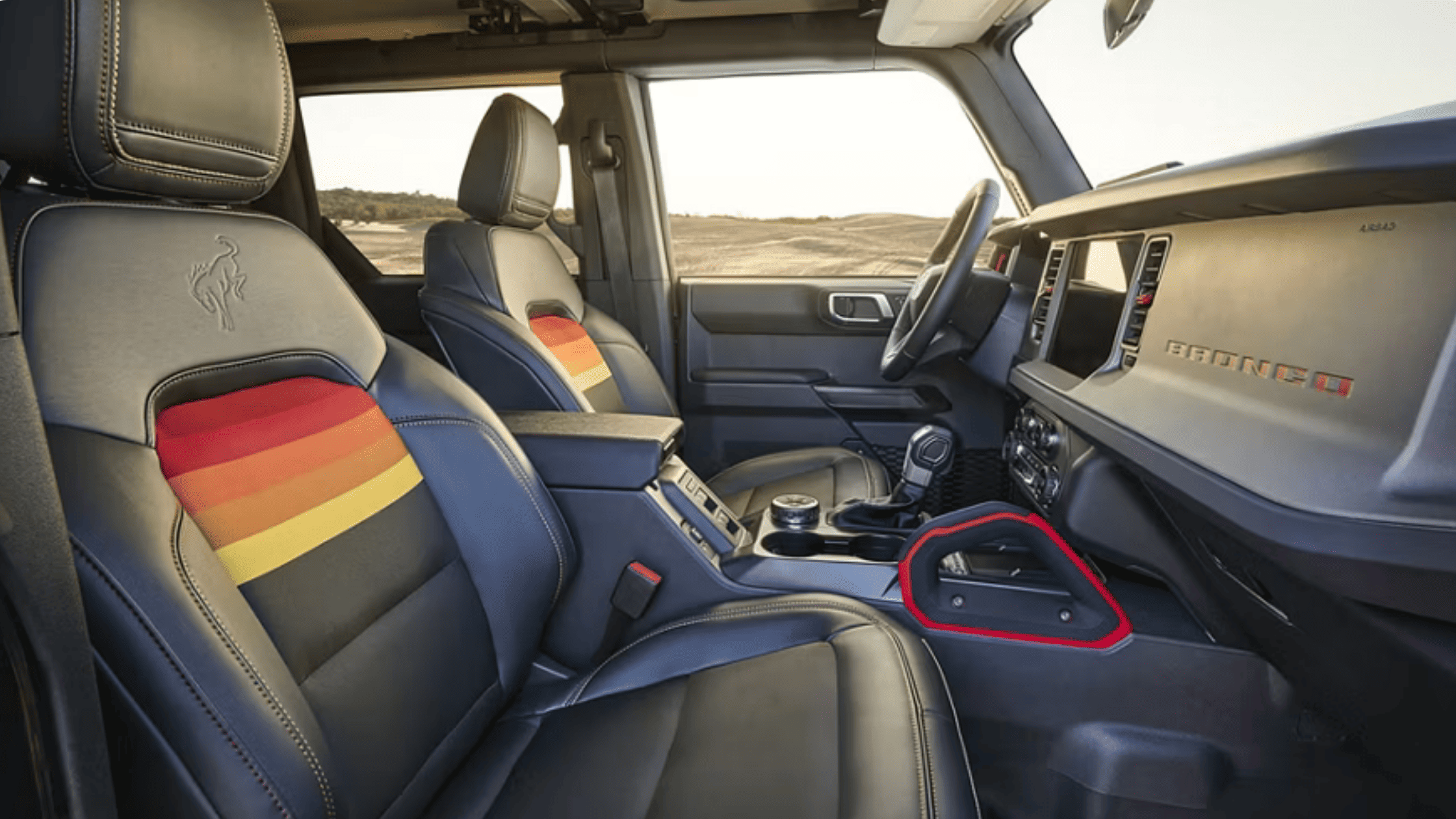 Front cabin view of a 2025 Bronco® showing its unique digital gauge cluster and heritage-inspired dashboard design near Concord, OH.