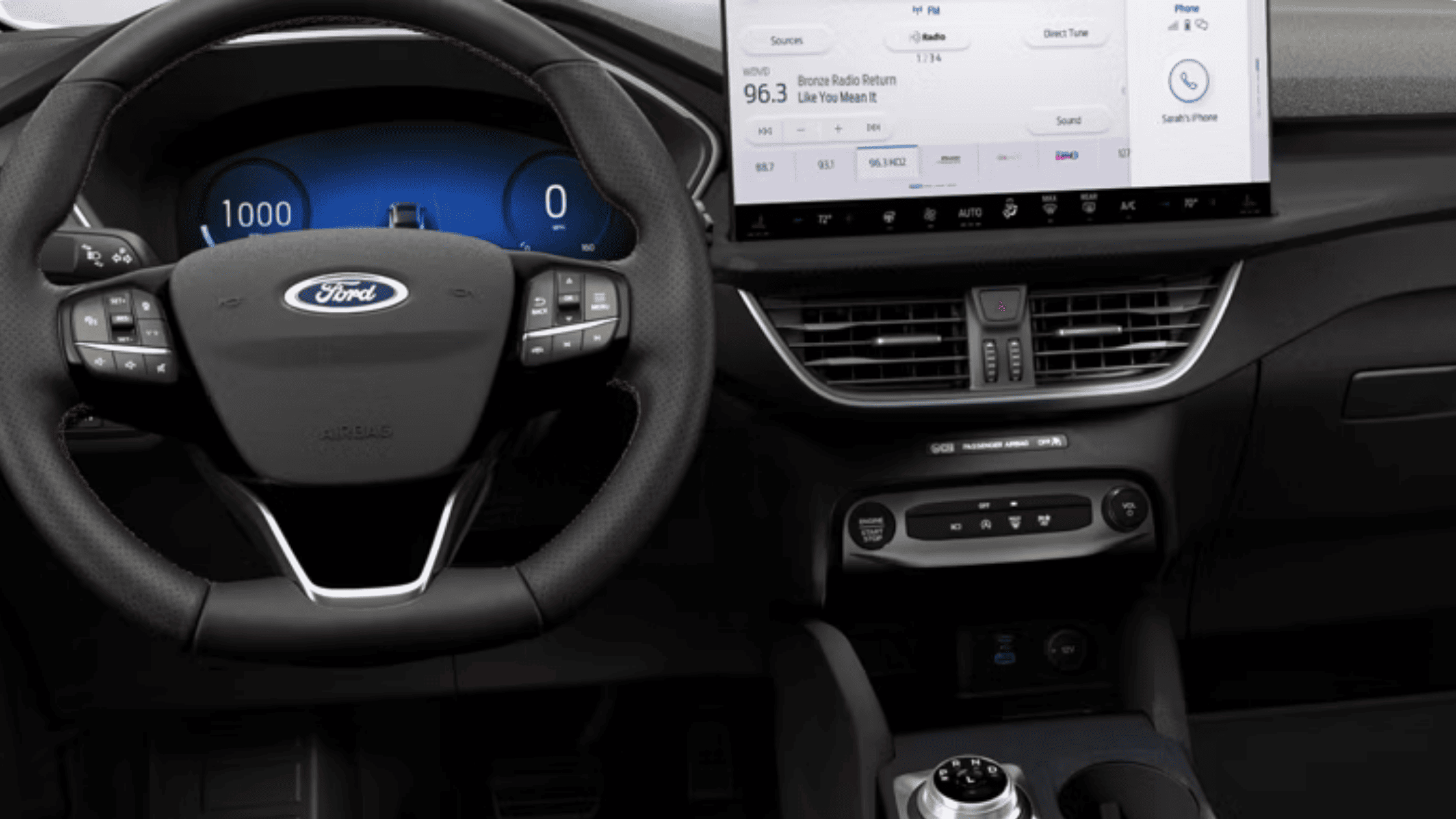 Driver cockpit of the 2025 Ford Escape® ST-Line Hybrid highlighting the digital gauge cluster and large infotainment screen.