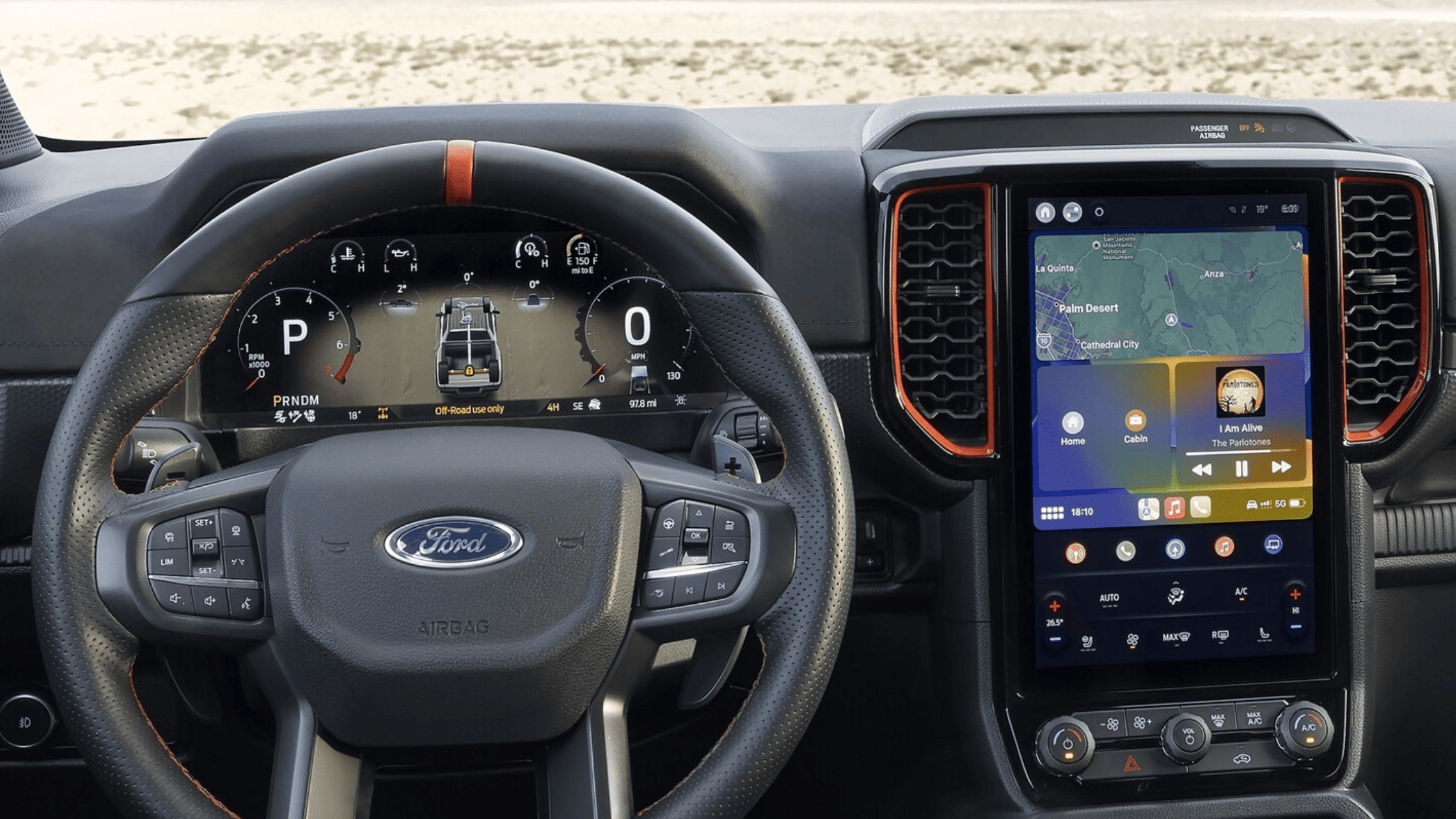 Interior of the 2025 Ford Ranger® featuring a digital instrument cluster, touchscreen infotainment system, and steering wheel controls for a modern driving experience.